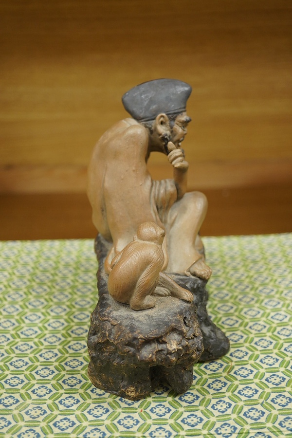 A Chinese Shiwan figure group of a luohan and monkey, housed in a fitted box, 21cm wide. Condition - good